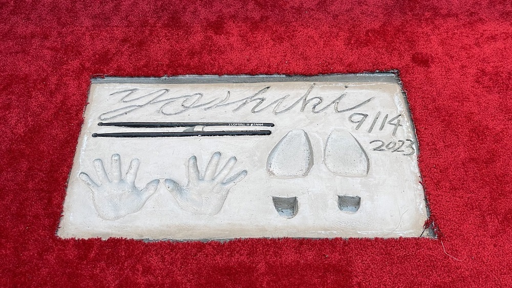 A member of rock band X Japan, Yoshiki became the first Japanese to be honored with the imprints. (X, formerly twitter)