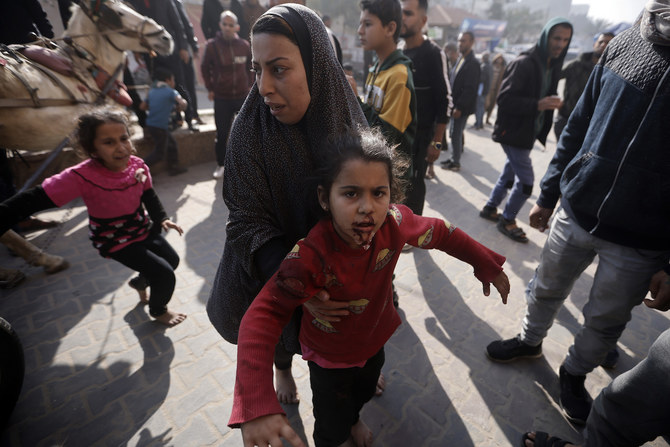 Palestinians wounded during the Israeli bombardment of the Gaza Strip are brought to the Nasser hospital in Khan Younis, Gaza Strip, Monday, Jan. 22, 2024. (AP)