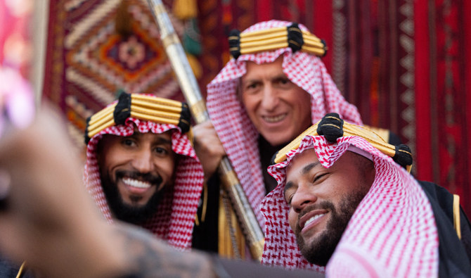 Neymar takes a selfie with teammate Salman Al-Faraj, left, and Hilal coach Jorge Jesus. (Al-Hilal)