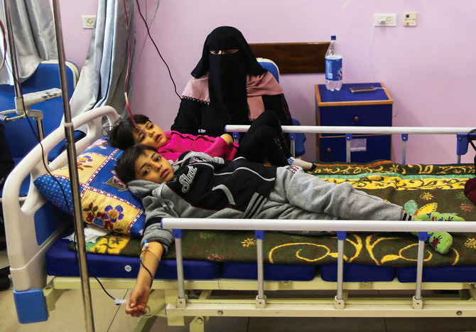 Palestinian children suffering from cancer receive treatment, main, at a hospital in prewar Gaza. The enclave once had a well-developed healthcare system. (AFP/File)