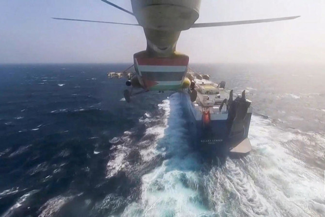 A frame grab shows Houthi members during the capture of Israel-linked cargo vessel Galaxy Leader at an undefined location in the Red Sea in November last year. The Houthis have been targeting commercial vessels as acts of solidarity with Palestinians in the Gaza Strip. (Ansarullah Media Centre/AFP)