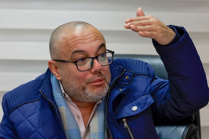 Palestinian Culture Minister Atef Abu Saif gestures during an interview at his office in the West Bank city of Ramallah. (AFP)
