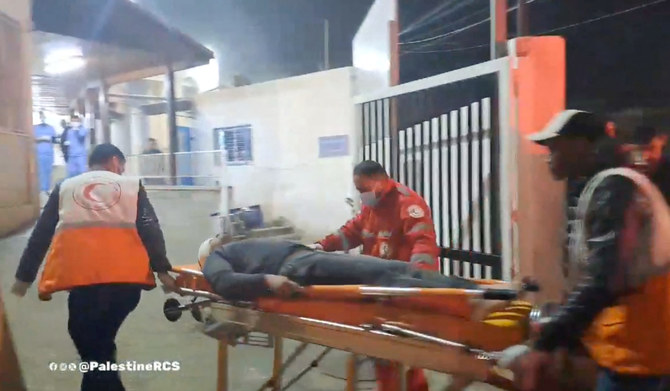 A man recovered from the rubble is transported by Palestine Red Crescent team in Rafah, Gaza, in this screen grab obtained from social media video released on February 9, 2024. (REUTERS)