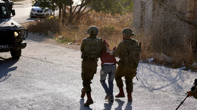 The Israeli military has told the BBC it will take disciplinary action against any soldiers implicated in recording and sharing online videos showing Palestinian detainees in degrading conditions. (AFP/File)