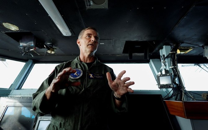 U.S. Navy Rear Adm. Marc Miguez, Commander of Carrier Strike Group Two, speaks to the media on the bridge of the USS Dwight D. Eisenhower aircraft carrier, Red Sea, Feb. 12, 2024. (Reuters)