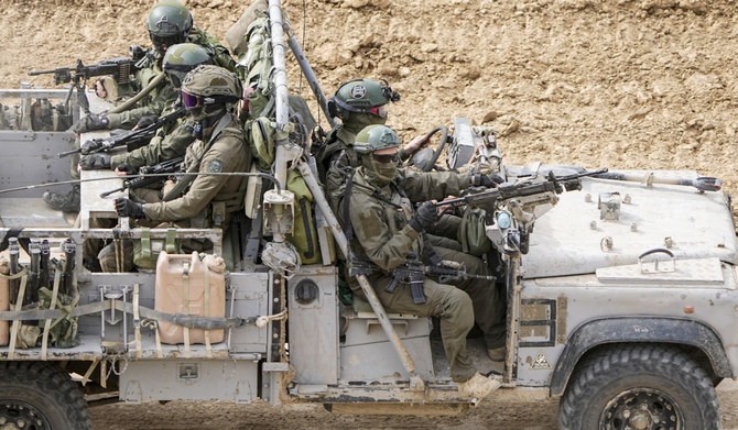 Israeli soldiers drive towards the Gaza Strip, in southern Israel, Tuesday, Feb. 13, 2024. (AP)