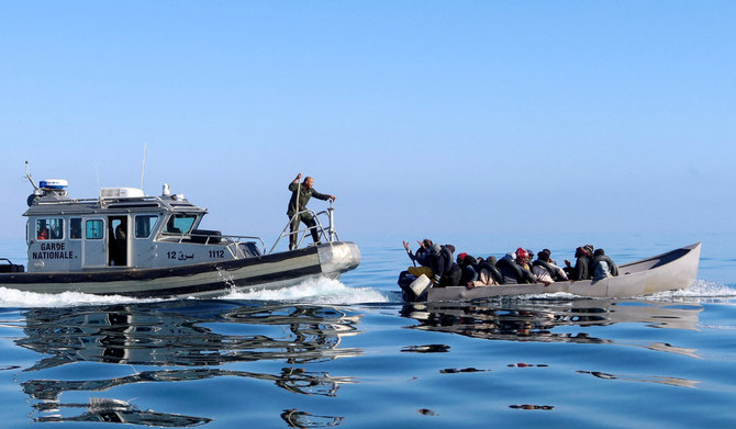 Tunisian coast guards try to stop migrants at sea during their attempt to cross to Italy, off the coast off Sfax, Tunisia April 27, 2023. (REUTERS)