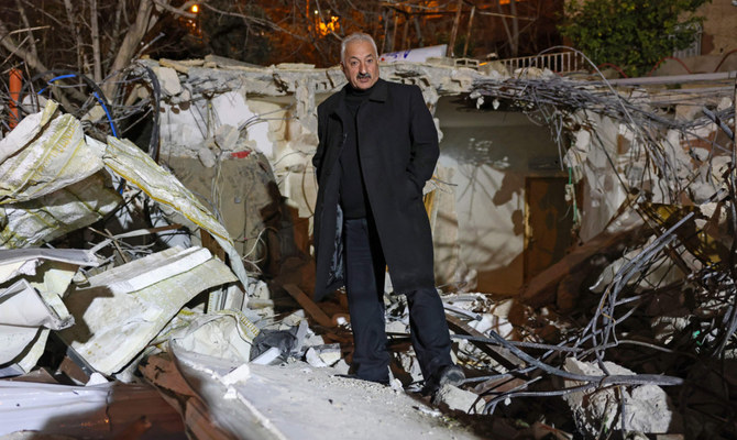 Palestinian activist Fakhri Abu Diab stands in the rubble of his home that was demolished by Jerusalem municipality workers in the mostly Arab east Jerusalem neighbourhood of Silwan on February 14, 2024. (AFP)