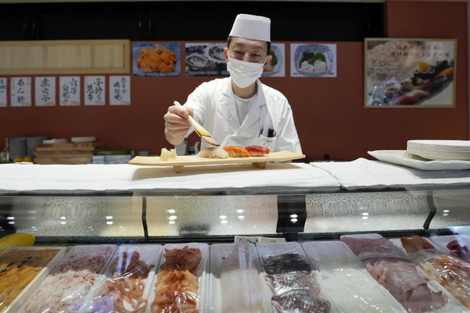 A sushi chef prepares a plate at the Toyosu Market in Tokyo on Jan. 29, 2024, in Tokyo. Japan has slipped to the world's fourth-largest economy, falling behind Germany. (AP/File)