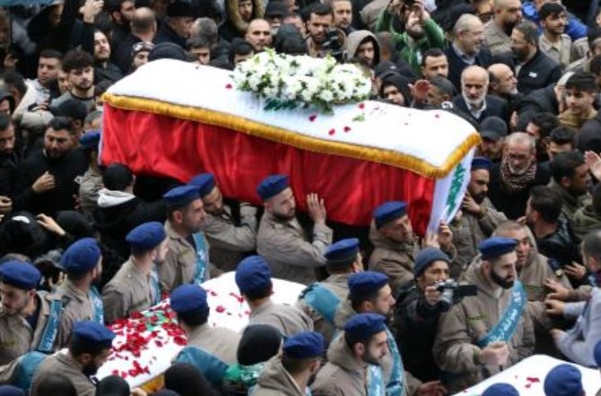 Hezbollah militants carry the flag-draped coffins of civilians killed in an Israeli strike on Feb. 14, during their funeral in the southern Lebanese town of Nabatiyeh, on Feb. 17, 2024. (AFP)