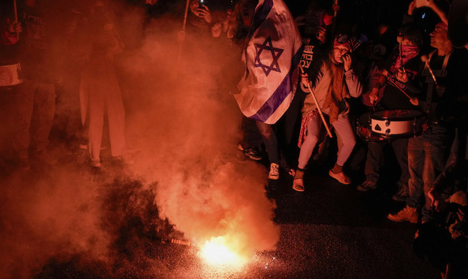 Demonstrators protest against Israeli Prime Minister Benjamin Netanyahu and call for new elections in the latest weekly protest against his handling of the Israel-Hamas war, in Tel Aviv, Israel, Feb. 17, 2024. (AP)