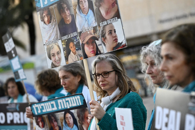 Demonstrators hold signs as they attend a rally calling for the release of hostages kidnapped in the deadly Oct. 7 attack on Israel by Hamas, in Tel Aviv on Feb. 20, 2024. (Reuters)