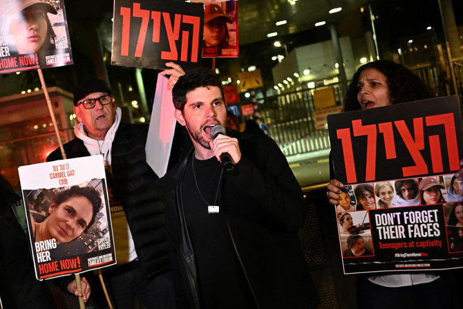 Demonstrators hold signs as they attend a rally calling for the release of hostages kidnapped in the deadly Oct. 7 attack on Israel by Hamas, in Tel Aviv, on Feb. 20, 2024. (Reuters)