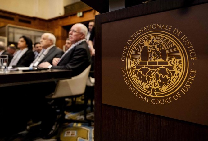 Above, Minister of Foreign Affairs of the Palestinian Authority Riyad Al-Maliki, right, and members of his delegation attend the International Court of Justice hearing in The Hague on Febru. 19, 2024. (AFP)