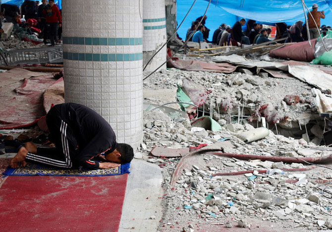 Israel says it will attack Rafah if no truce agreement is reached soon. Above, a Palestinian man performs Friday prayers at the ruins of a mosque destroyed in Rafah on Feb. 23, 2024. (Reuters)