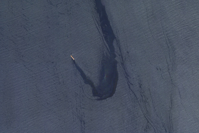 In this satellite image provided by Planet Labs, the Belize-flagged bulk carrier Rubymar is seen in the southern Red Sea near the Bay el-Mandeb Strait leaking oil after an attack by Yemen’s Houthi on Feb. 20, 2024. (AP)