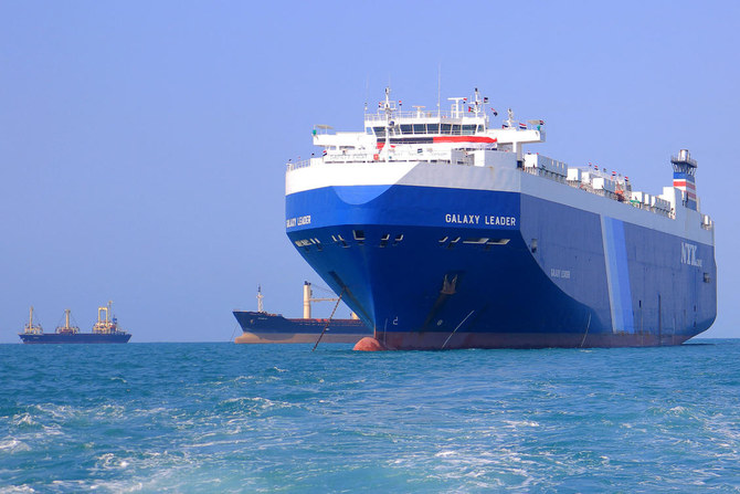 File picture taken during an organized tour by Yemen’s Houthi rebels on November 22, 2023 shows the Galaxy Leader cargo ship (R), seized by Houthi fighters two days earlier, approaching the port in the Red Sea off Yemen’s province of Hodeida.(AFP) 