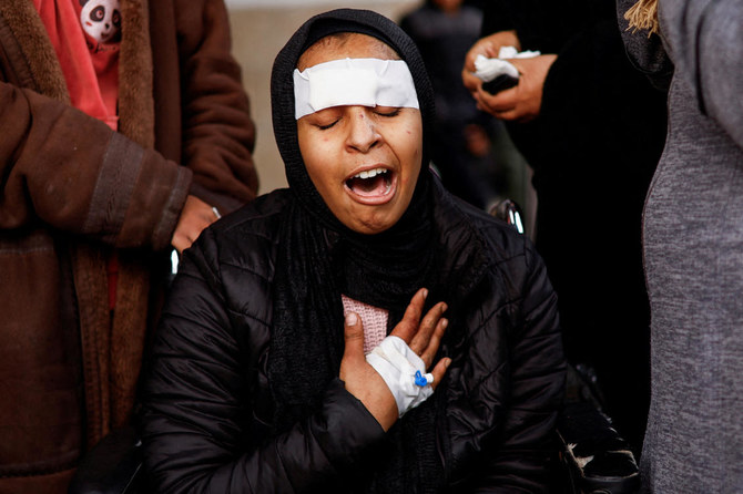 A Palestinian woman injured in an Israeli strike mourns the death of her sibling in the strike, amid the ongoing conflict between Israel and the Palestinian Islamist group Hamas, at Abu Yousef Al-Najjar hospital in Rafah in the southern Gaza Strip February 23, 2024. (REUTERS)