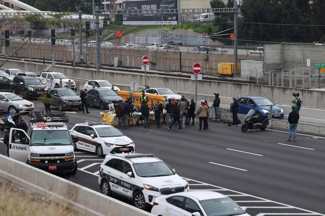 Supporters and families of Israeli hostages held in Gaza since the Oct. 7 attacks block a highway in Tel Aviv during a protest calling for their return on Feb. 23, 2024. (AFP)