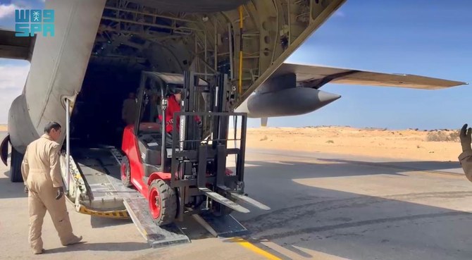 The two trucks and forklifts were delivered to the Egyptian Red Crescent to facilitate the loading and transportation of aid arriving at El-Arish for the people of Gaza. (SPA)