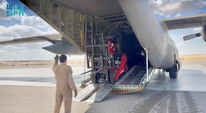 The two trucks and forklifts were delivered to the Egyptian Red Crescent to facilitate the loading and transportation of aid arriving at El-Arish for the people of Gaza. (SPA)