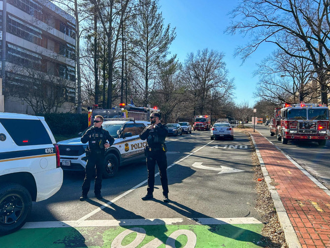 Members of the US Secret Service uniformed division block access to a street leading to the Embassy of Israel in Washington, DC on Feb. 25, 2024. A man reportedly set himself on fire near the embassy on Sunday afternoon. (AFP)