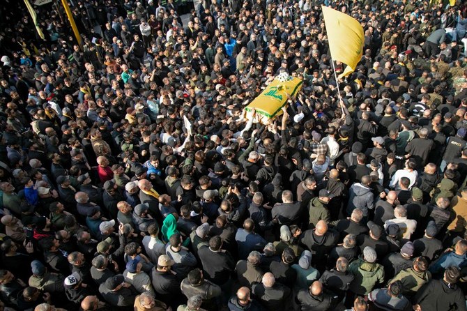 Mourners attend the funeral of Hezbollah fighter Hassan Salame in his hometown village of Khirbet Selm on Feb. 27, 2024. (AFP)