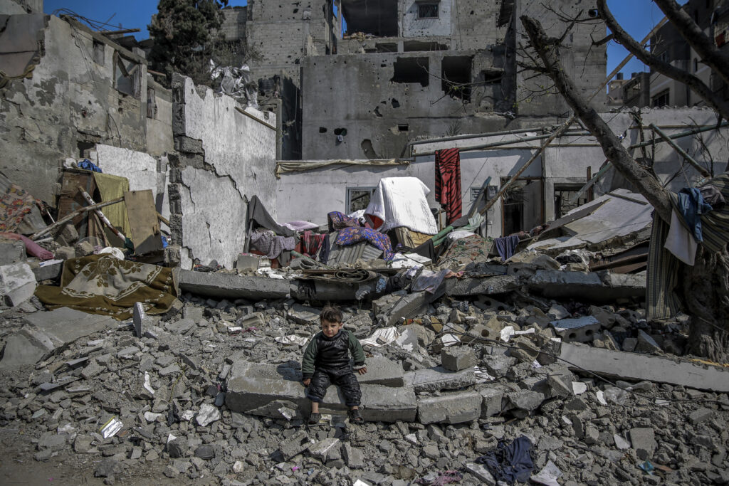 A Palestinian child sits amid debris of near a building destroyed during Israeli strikes in Beit Lahia in the northern Gaza Strip amid continuing battles between Israel and Hamas. (File/AFP)