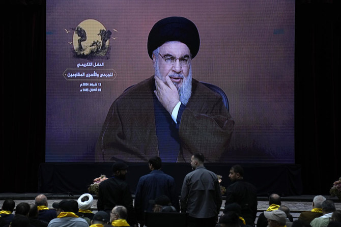 Hezbollah leader Hassan Nasrallah, speaks via a video link, during a rally to mark “wounded resistant’s day,” in the southern suburb of Beirut on Feb. 13, 2024. (AP)