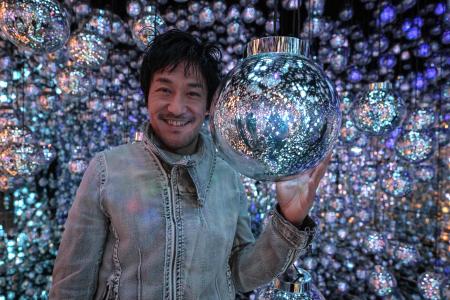 Toshiyuki Inoko, founder of teamLab, poses during an interview with AFP after a media tour of the new location for the digital art of Japanese collective 