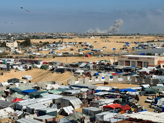 Smoke rises during Israeli ground operation in Khan Younis, as seen from a tent camp sheltering displaced Palestinians in Rafah, Gaza Strip, Feb. 22, 2024. (Reuters)