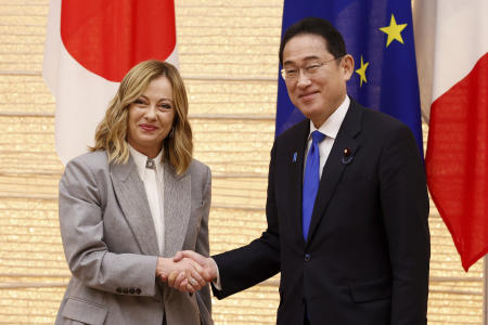Italian Prime Minister Giorgia Meloni and her Japanese counterpart Fumio Kishida, right, pose for the cameras during a Japan-Italy bilateral meeting at Japan's prime minister office in Tokyo, Monday, Feb. 5, 2024. (AP)