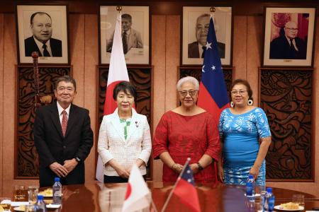 Japan’s Minister of Foreign Affairs Yoko Kamikawa (second left), Samoa's Prime Minister Afioga Fiame Naomi Mata'afa (second right), Japan Ambassador to Samoa Keisuke Santa (left), and Vice Chancellor for the National University of Samoa Tuifuisa’a Patila Amosa (right) pose following a signing ceremony in Apia on February 10, 2024. (AFP)