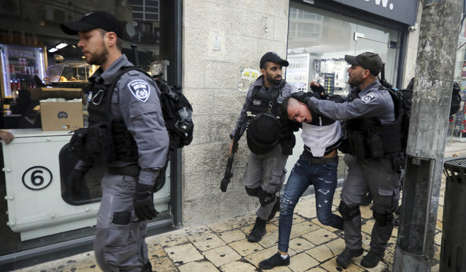 Israeli police arrest a Palestinian during a protest demanding a release of Heba al-Labadi, a Jordanian citizen of Palestinian descent, in east Jerusalem, Saturday, Oct. 26, 2019. (AP)