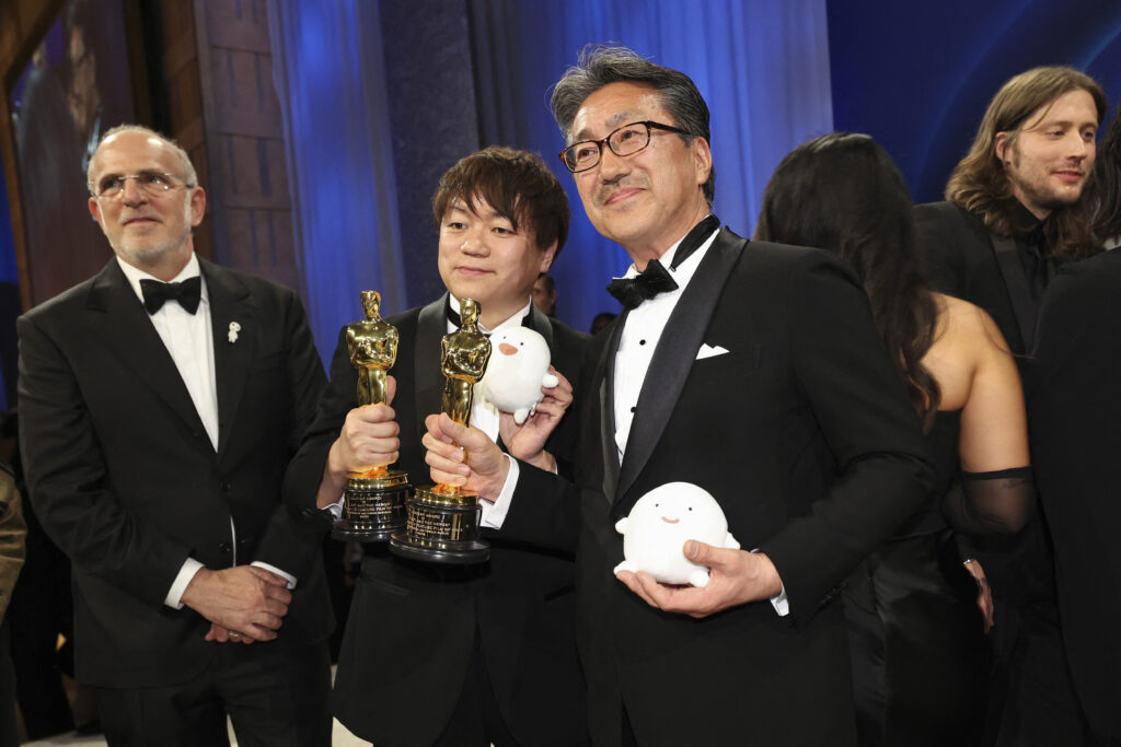 Kiyofumi Nakajima and Kenichi Yoda pose with the Oscar for Best Animated Feature Film for 