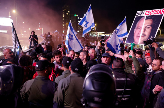 Police officers block the way to demonstrators during a protest in Tel Aviv on March 23, 2024, calling for the release of hostages kidnapped in the deadly October 7 attack on Israel by Hamas militants from Gaza. (Reuters)