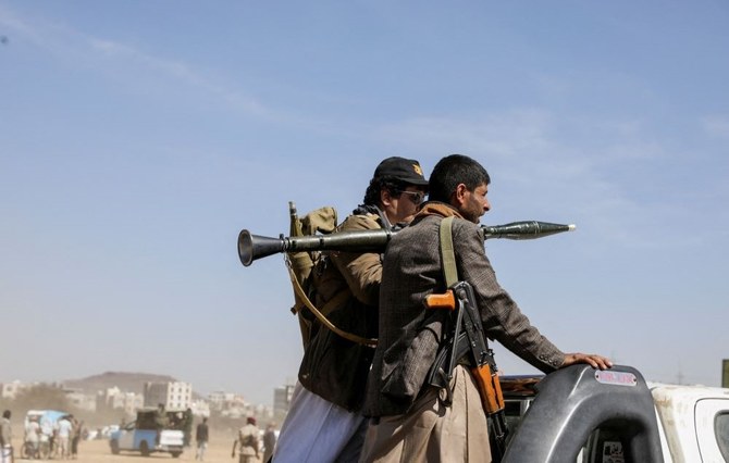 Armed Houthi followers, on the back of a pick-up truck, rally in support of Houthi strikes on ships in the Red Sea and the Gulf of Aden, Sanaa, Yemen Jan. 29, 2024. (Reuters)