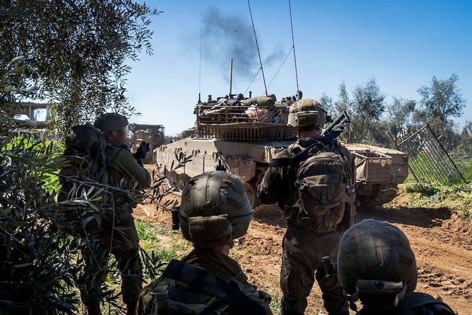 Above, Israeli troops on the ground in the Gaza Strip. Negotiations for a ceasefire between Hamas and Israel are on impasse over conditions of a proposed a six-week truce. (Israeli Army/AFP)