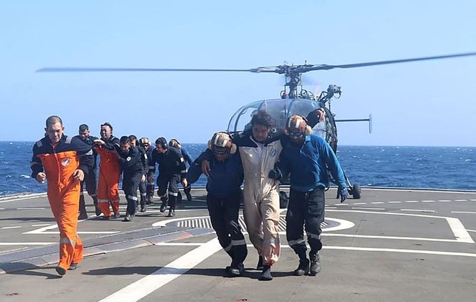 Crew members of the Barbados-flagged bulk carrier M/V True Confidence are rescued by the Indian Navy after a Houthi missile attack, in the Gulf of Aden, off Yemen, Mar. 6, 2024. (AFP/Indian Navy)