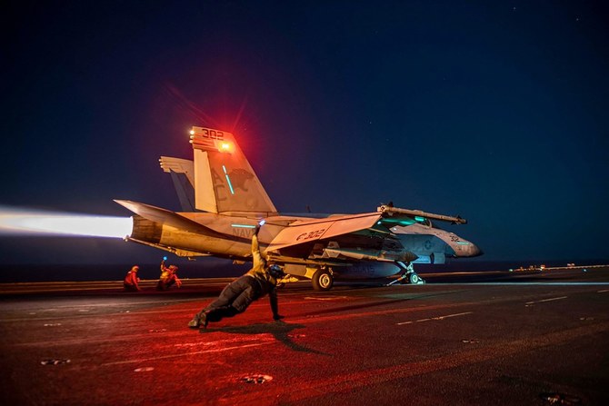 Image released by the US Central Command, a US fighter plane launches from the deck of the aircraft carrier USS Eisenhower in the Red Sea during operations against Houthi targets (AFP)