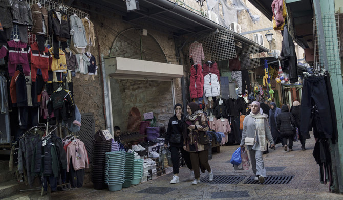 Muslim women walk through a market, ahead of the holy Islamic month of Ramadan, in the Old City of Jerusalem, Thursday, March 7, 2024. (AP)