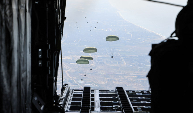 This handout picture released by the Jordanian army on March 11, 2024, shows humanitarian aid being airdropped from a military aircraft over the Gaza Strip, amid ongoing battles between Israel and the Palestinian militant group Hamas. (AFP)