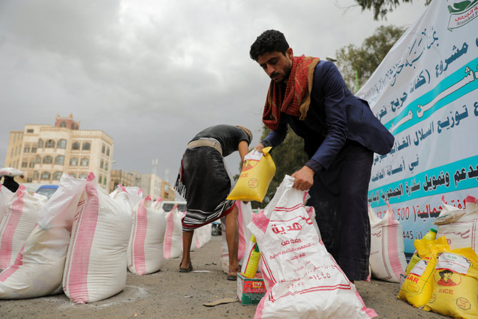Workers prepare foodstuff provided by the Iranian embassy in Sanaa, Yemen, on March 13, 2024, to be distributed to Houthi fighters who were wounded in war. (Reuters)