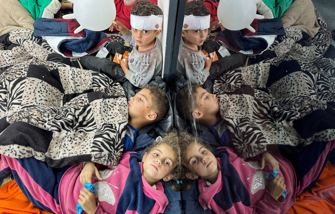 Palestinian children wounded in an Israeli strike rest as they receive treatment at a hospital, amid the ongoing conflict between Israel and the Palestinian Islamist group Hamas, in Rafah in the southern Gaza Strip, February 12, 2024. (REUTERS)