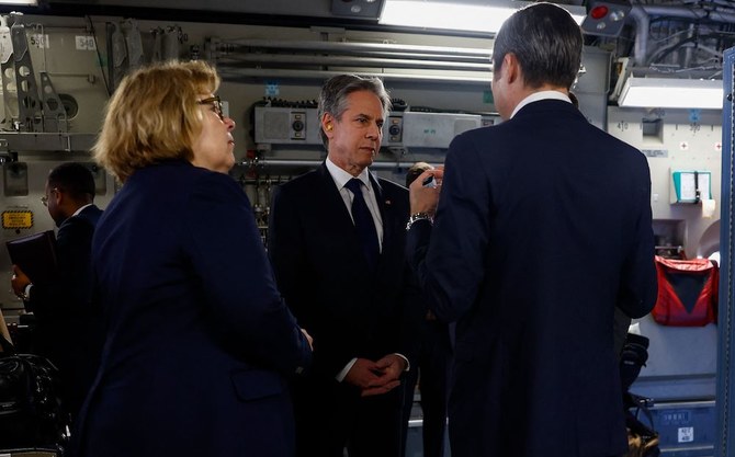 Above, US Secretary of State Antony Blinken, center, aboard a C-17 Globemaster as he departs for Cairo on March 21, 2024. (AFP)