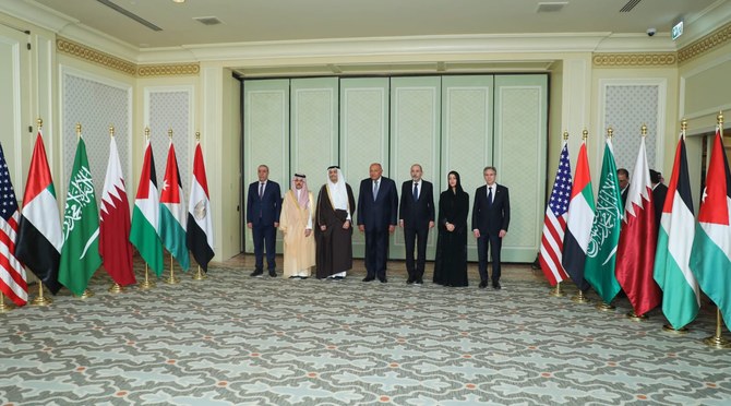 Government ministers from five Arab countries, a Palestinian official, and US Secretary of State Antony Blinken pose for a photo in Cairo on Thursday. (@MfaEgypt)