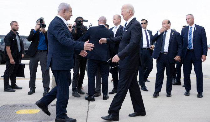Israel Prime Minister Benjamin Netanyahu (L) greets US President Joe Biden upon his arrival at Tel Aviv's Ben Gurion airport on October 18, 2023, amid the ongoing battles between Israel and the Palestinian group Hamas. (AFP)