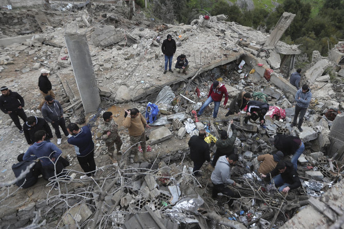 People search for victims in the rubble of a paramedic center that was destroyed by an Israeli airstrike in Hebbariye village, south Lebanon, on Mar. 27, 2024. (AP)