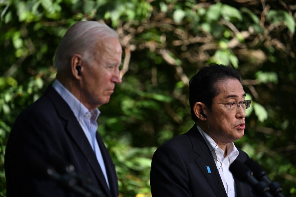 US President Joe Biden listens to Japanese Prime Minister Fumio Kishida speaks during a press conference during the Camp David Trilateral Summit, at Camp David in Maryland on August 18, 2023. (AFP)