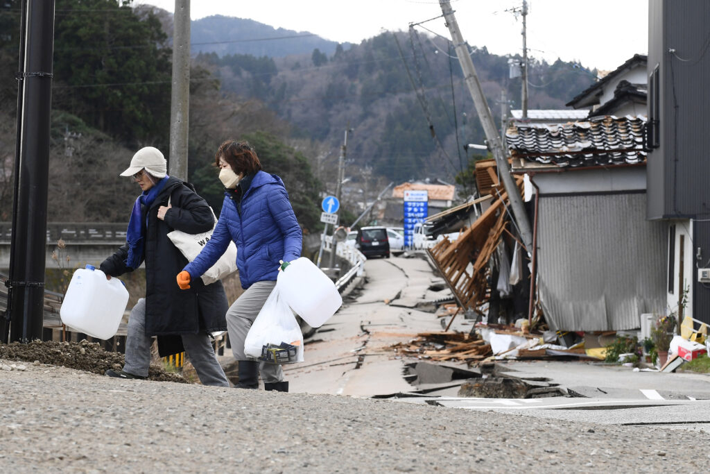 The 7.6-magnitude New Year's Day earthquake, which measured up to the maximum level of 7 on the Japanese seismic intensity scale, cut off water supplies almost across the city. (AFP)